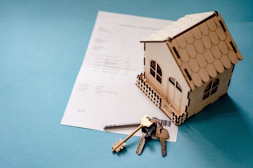Calculator and contract showing property purchase costs in Spain