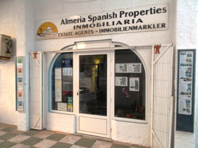 Family-run real estate agents meeting clients in their Roquetas de Mar office
