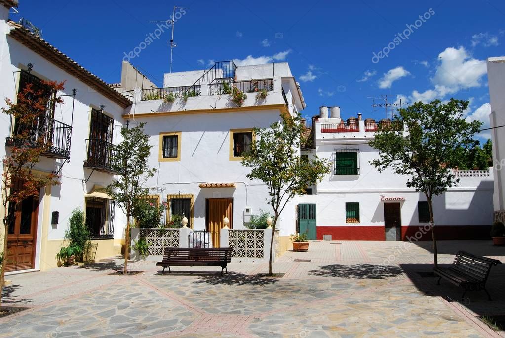 Spanish townhouse with balconies on a quiet street in Roquetas de Mar
