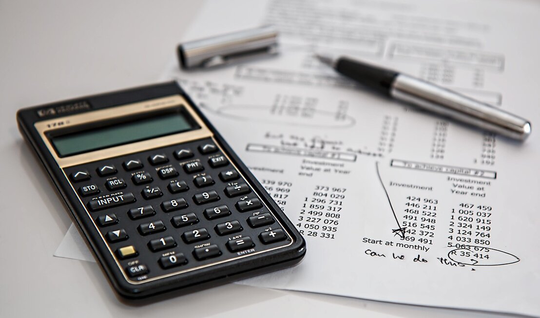 Documents and keys representing legal, banking and insurance support when buying property in Spain